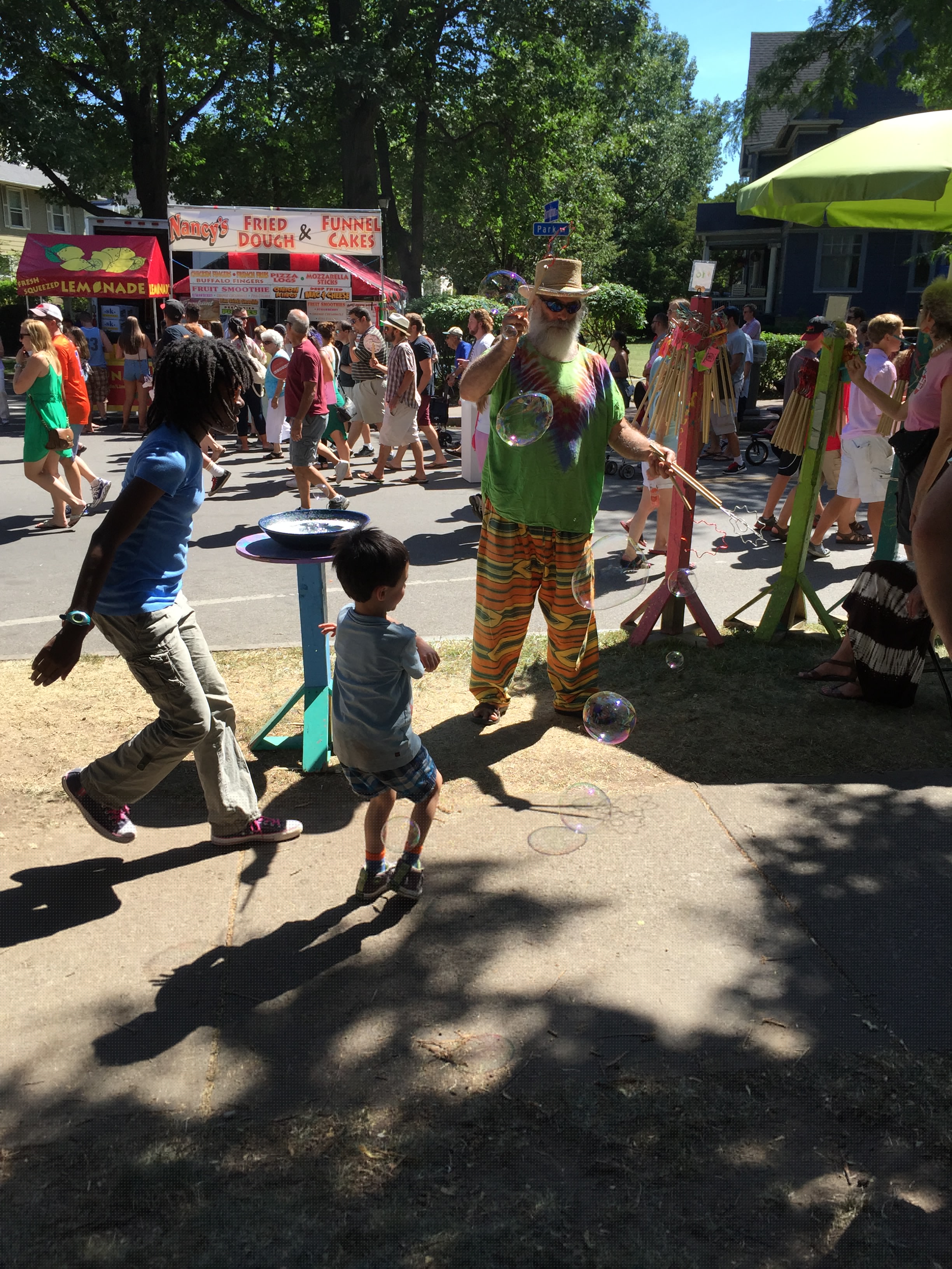 My son having fun with bubbles at the Park Ave. Festival, one of those many "weekend activities."